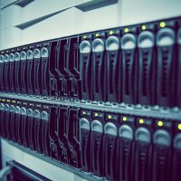 Black rack mounted server tower in large data center